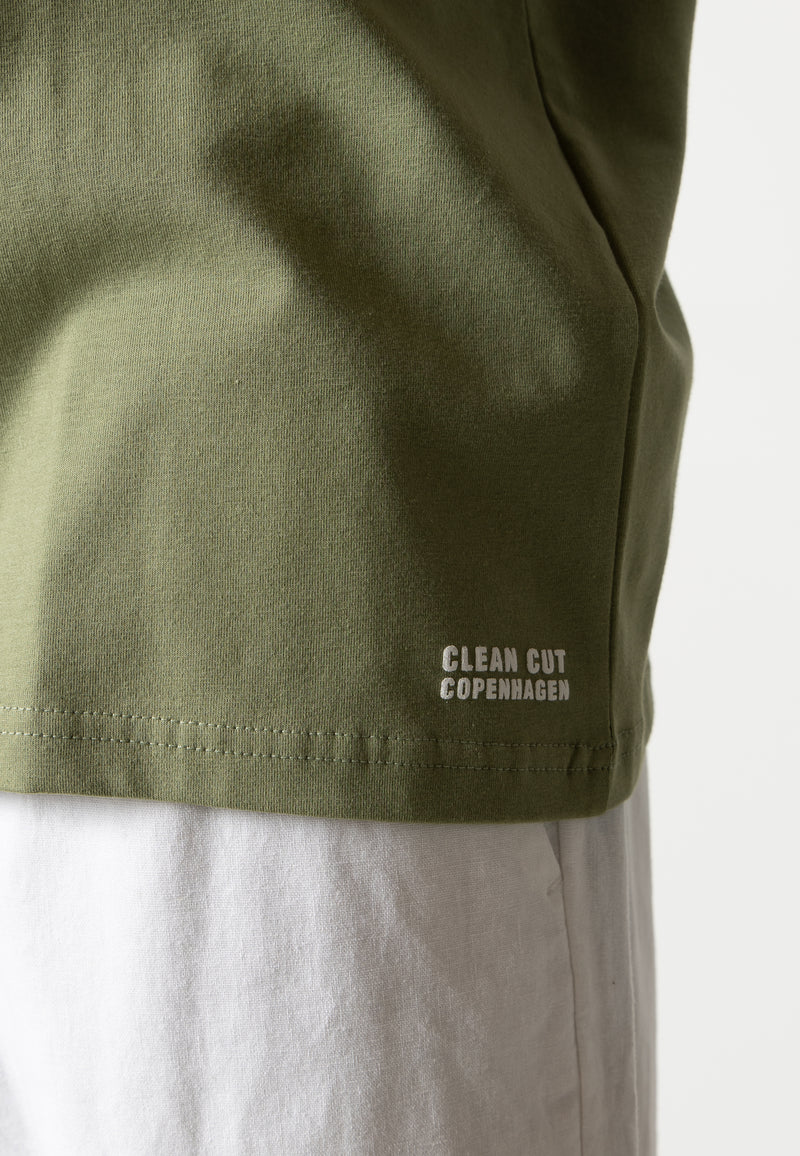 Clean Cut Copenhagen Cross organic logo t-shirt T-shirts S/S Dusty Green